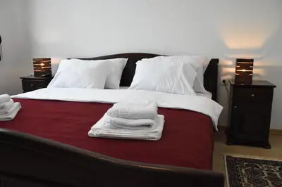 a bedroom with a bed with towels on it at Kod Bogdanovica in Vrtovac