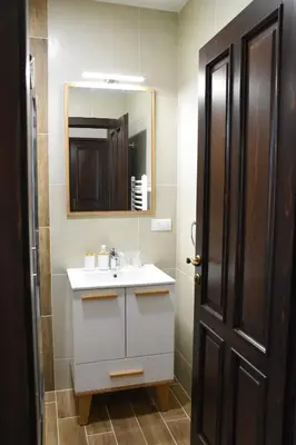 a bathroom with a sink and a mirror at Kod Bogdanovica in Vrtovac
