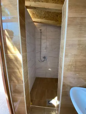 a bathroom with a shower with a sink at Vikvid in Nišor