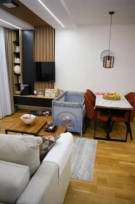 a living room with a couch and a table at Apartman North resort in Vrnjačka Banja