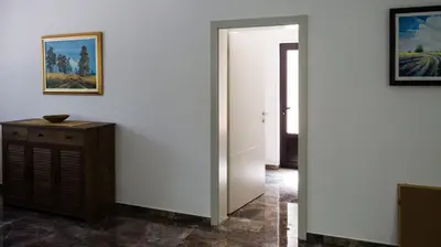 a hallway with a door leading into a room at Lesnik vacation home in Despotovac