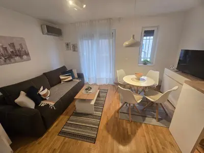 a living room with a couch and a table at Apartman Sorelle in Vrnjačka Banja