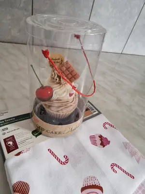 a plastic container with a dessert in it on a table at Jasemin in Ćuprija