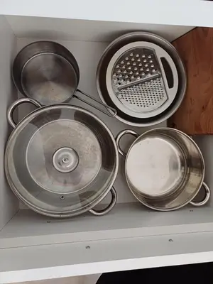 a bunch of metal pans sitting on a shelf at Natura Lux & Parking Free - Green Hill, blizu Akva parka in Soko Banja