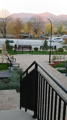 a group of park benches in a park at Natura Lux & Parking Free - Green Hill, blizu Akva parka in Soko Banja