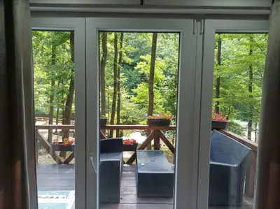 a view of a porch from a sliding glass door at Planinska vila KTM Lisine in Despotovac