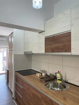 a kitchen with a sink and a counter top at Apartmani Vrla NEW in Vladičin Han