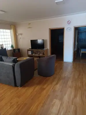 a living room with two couches and a television at APARTMAN Buba in Pirot