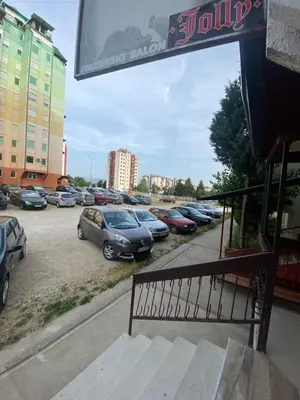 a bunch of cars parked in a parking lot at Vito Apartman - Free Parking in Vranje