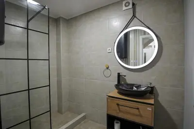 a bathroom with a sink and a mirror at 4-teen in Jagodina