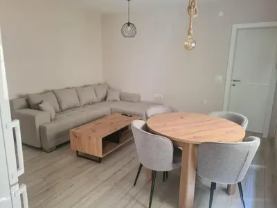 a living room with a table and a couch at 4-teen in Jagodina