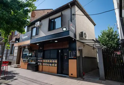 a store front of a building on a street at Trpeza Luxury Apartments, free parking in Niš