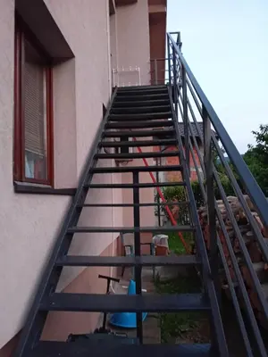 a set of stairs leading up to a building at Apartman Anči in Vrnjačka Banja