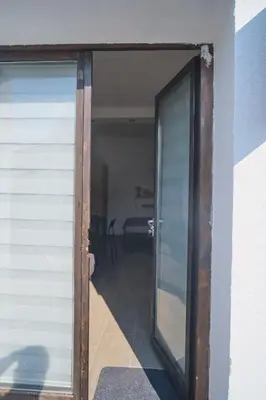 a sliding glass door of a house with a patio at Studio Melem 2 in Soko Banja