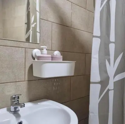 a bathroom with a sink and a mirror at Studio Melem 3 in Soko Banja
