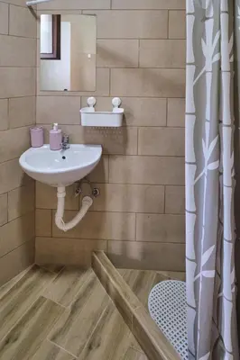 a bathroom with a sink and a shower at Studio Melem 3 in Soko Banja