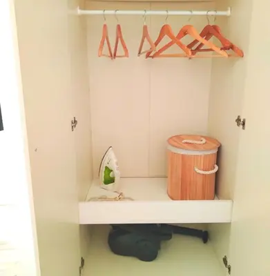 a childs playroom with a shelf and a trash can at City Center Sweet Apartment in Niš
