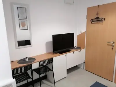 a room with a desk with a television on it at Studio Ukras in Vrnjačka Banja