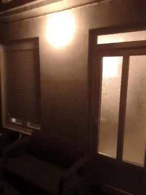 a room with a window and a light on the wall at Apartman Djordjevic in Vranje