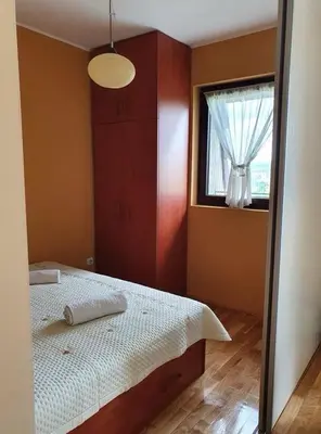 a bedroom with a bed and a window at Soko Banjica in Soko Banja