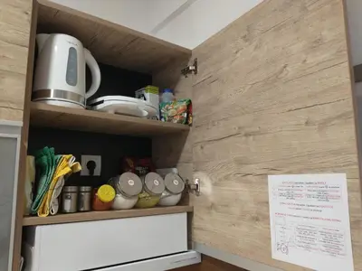 a kitchen with a cupboard with food items on it at Pavic SPA Milmari L34 in Kopaonik