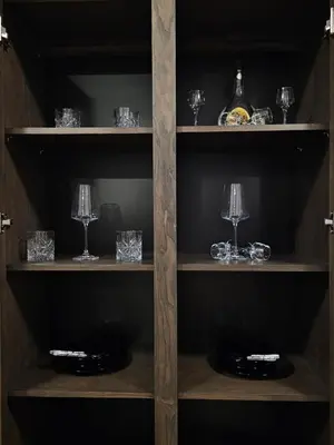 a wooden shelf with glasses and plates on it at Ema HILLS in Vranje