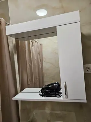 a mirror on a shelf in a bathroom at Ema HILLS in Vranje