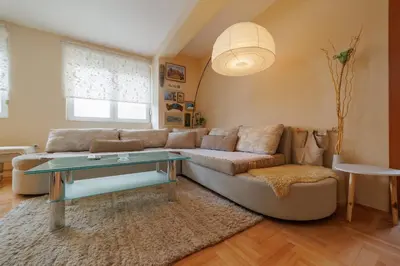 a living room with a couch and a table at Lux 010 in Pirot