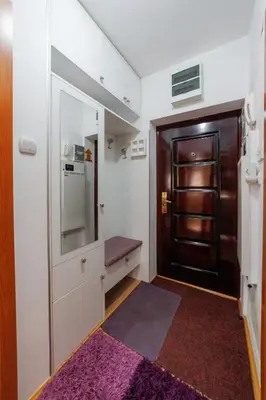 a small room with a door and a hallway at Lux 010 in Pirot