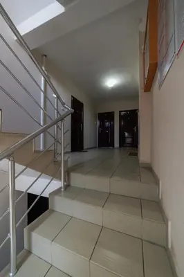 a staircase in a building with a stair case at Lux 010 in Pirot