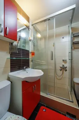 a bathroom with a toilet sink and a shower at Lux 010 in Pirot