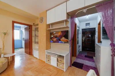 a bedroom with a large closet with a dresser at Lux 010 in Pirot