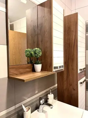 a bathroom with a sink and a mirror at Lumo in Niš