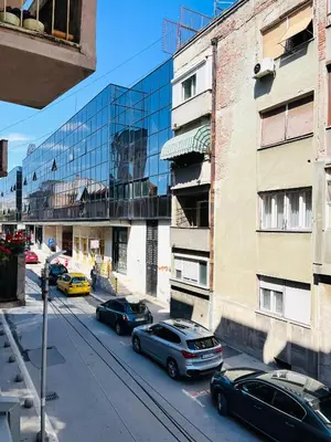 a group of cars parked in front of a building at Lumo in Niš