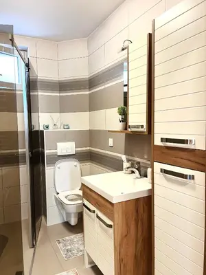 a bathroom with a toilet and a sink at Lumo in Niš