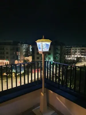 a street light on a balcony at night at HelVik Apartman Aqua Park in Vrnjačka Banja
