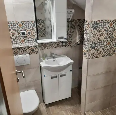 a small bathroom with a sink and a toilet at Studio Djukić Sokobanja in Soko Banja