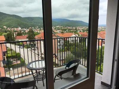 a view of a balcony with a table and chairs at Apartman Popovic in Soko Banja