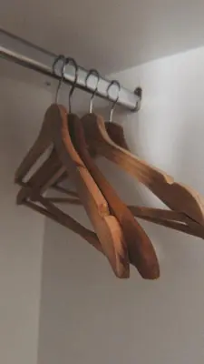 a bunch of wooden utensils hanging on a rack at Vila Golija Peak Suites in Kopaonik