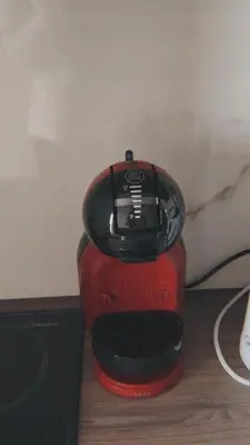 a red and black blender sitting on a table at Vila Golija Peak Suites in Kopaonik