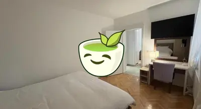 a bedroom with an apple painted on the wall at Petra Apartments in Jagodina