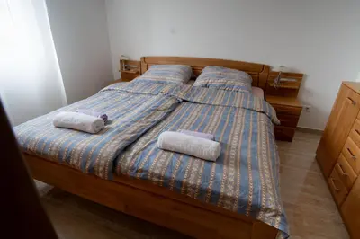 a bedroom with a bed with two pillows on it at Raj Petrović in Kovanluk