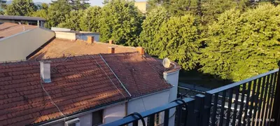 an overhead view of roofs of buildings and trees at CENTAR CEPERKOVIC in Vrnjačka Banja