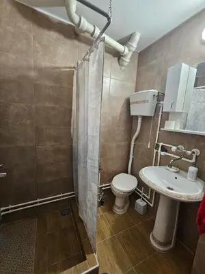 a bathroom with a toilet and a sink at Apartman Purić in Pirot