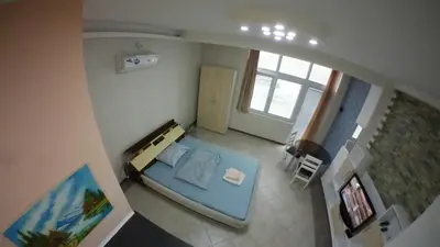 an overhead view of a bedroom with a blue bed at Cozy Quiet Apartment Nis in Niš