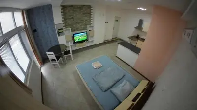 an overhead view of a living room with a television at Cozy Quiet Apartment Nis in Niš