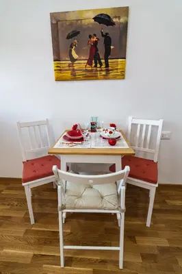 a table with two chairs and a table with an umbrella at Gracija in Jagodina