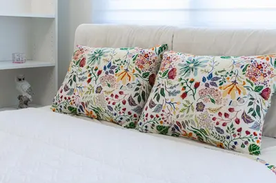 a bed with two pillows on top of it at Gracija in Jagodina