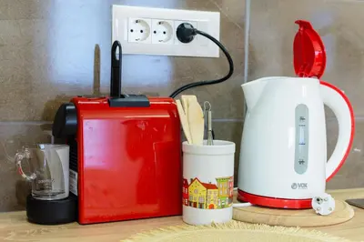 a counter with a coffee maker and a toaster at Gracija in Jagodina
