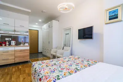a bedroom with a bed and a flat screen tv at Gracija in Jagodina